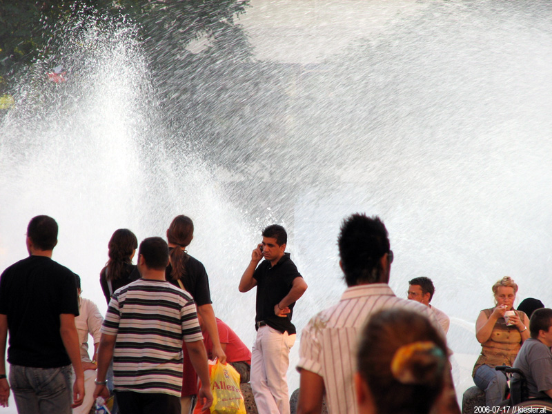 People in front of fountain